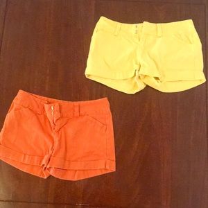 2 pair orange and yellow shorts